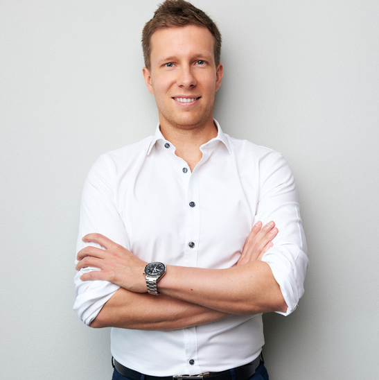 Jakub Żurawiński in a white shirt